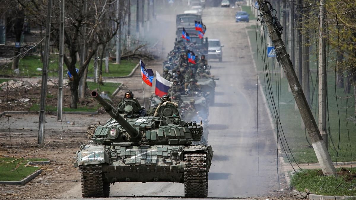 An armoured convoy of pro-Russian troops moves along a road during Ukraine-Russia conflict in the southern port city of Mariupol. Credit: Reuters photo