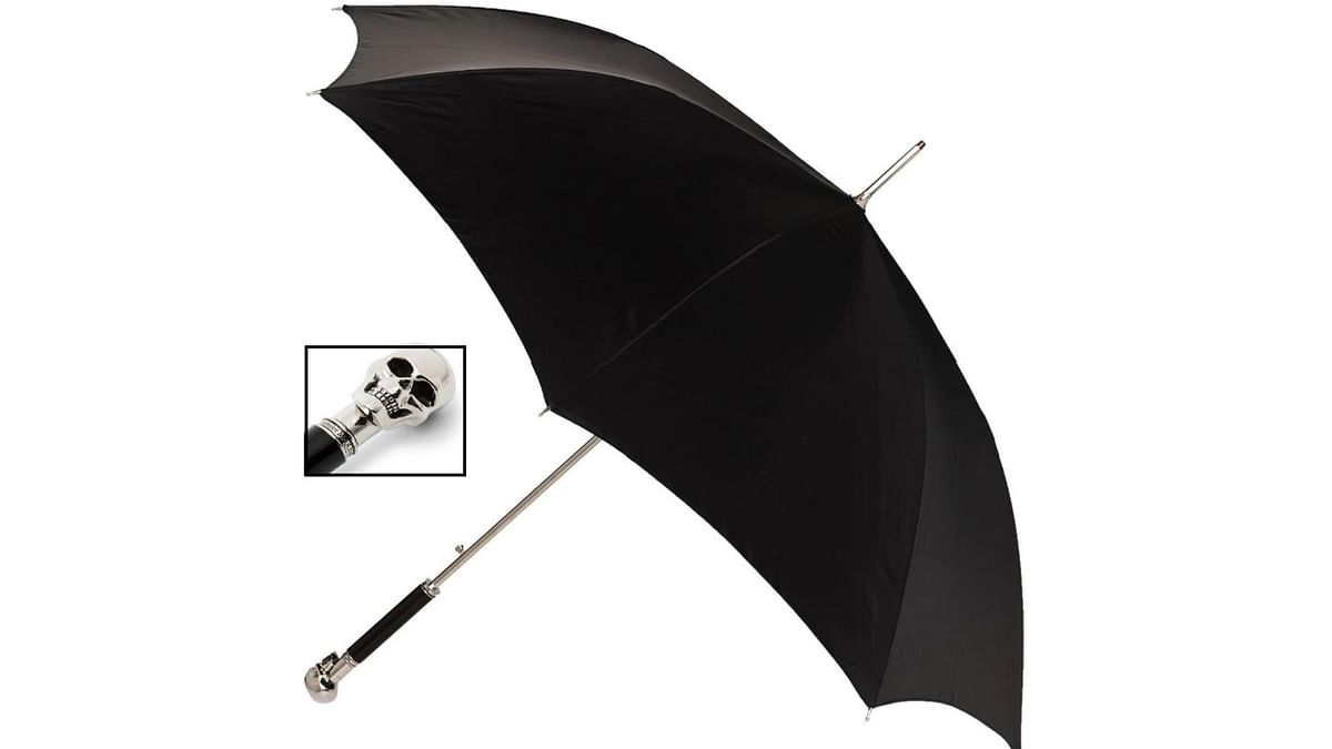 Skull handle: This Alexander McQueen umbrella with a skull handle is irresistible. The large handle will make sure the umbrella doesn’t slip off from your hand. It is priced at Rs 49,135. Credit: Farfetch.com