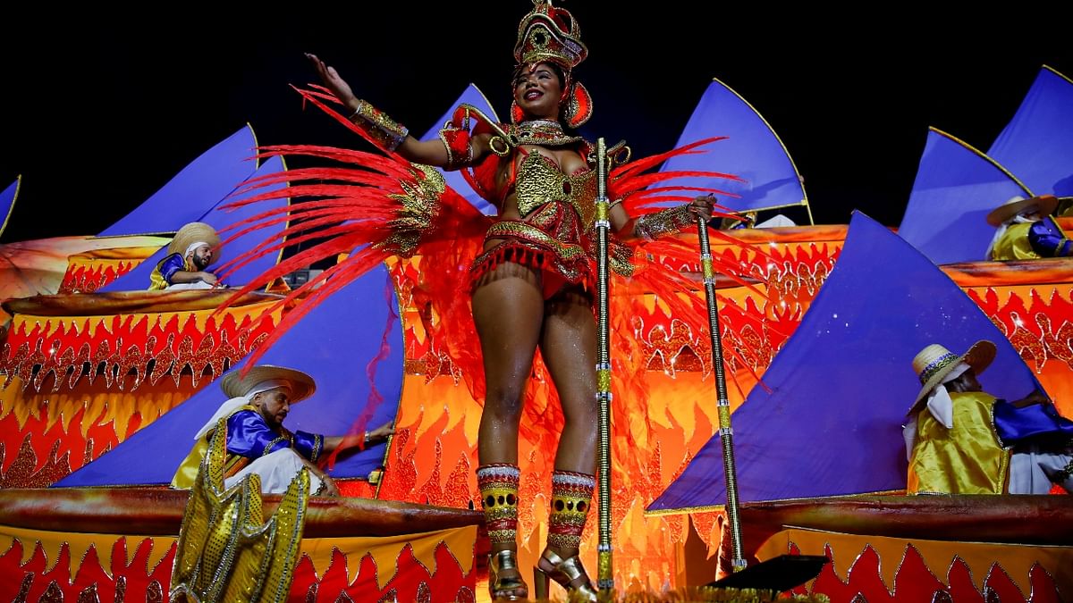 An artist performs during the second night of the Carnival parade at the Sambadrome in Rio de Janeiro, Brazil. Credit: Reuters Photo