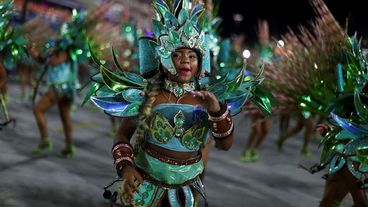 Muses in the Imperatriz Leopoldinense school dressed as the Iemanja deity of Afro-Brazilian religions, were thrilled to be back at the Sambadrome. Credit: Reuters Photo