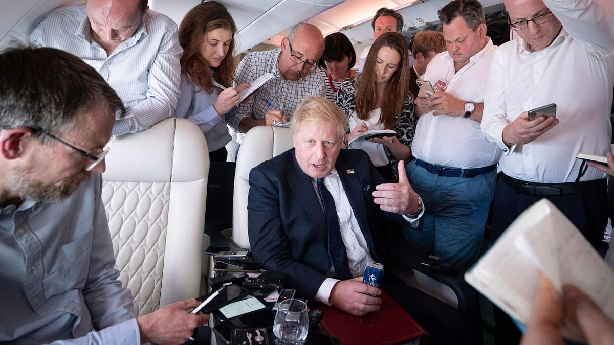 British Prime Minister Boris Johnson while speaking to the media on board his flight to India. Credit: PTI Photo