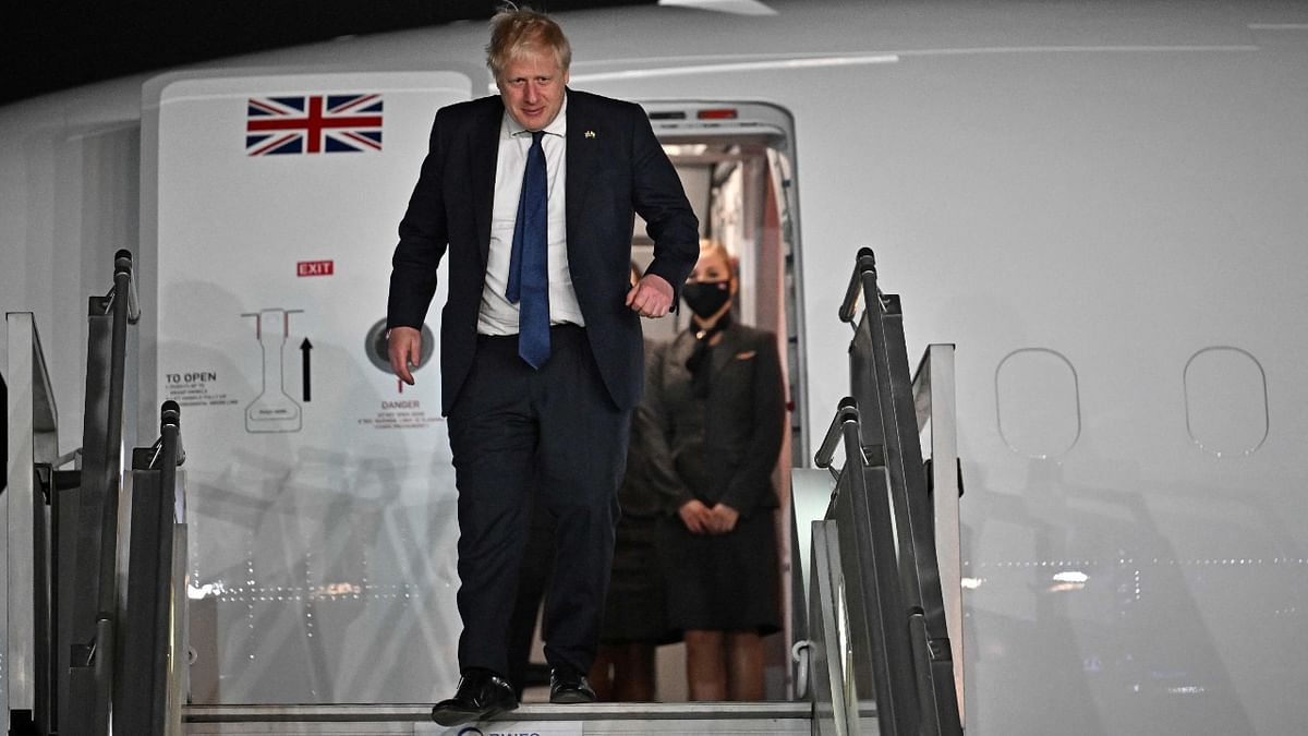 PM Boris Johnson disembarking the plane having arrived at Indira Gandhi International Airport in New Delhi after a day of engagements in Gujarat. Credit: AFP Photo