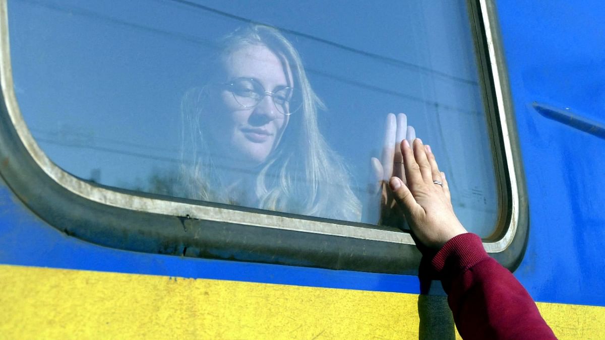 A woman says goodbye to her relative aboard a train travelling to Przemysl, Poland, amid Russia's invasion of Ukraine in Odessa. Credit: Reuters Photo