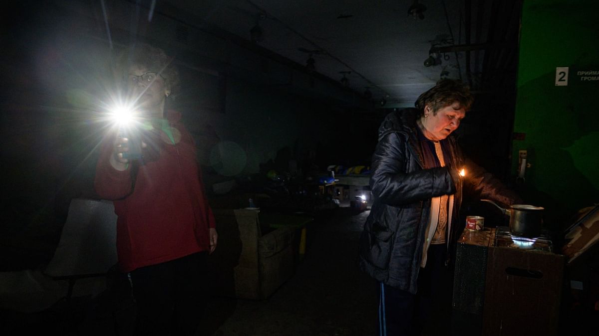 Residents gather in a basement used as a shelter after hearing the sound of a nearby shelling attack in the frontline town of Hulyaipole, southeast of Zaporizhzhia. Credit: AFP Photo