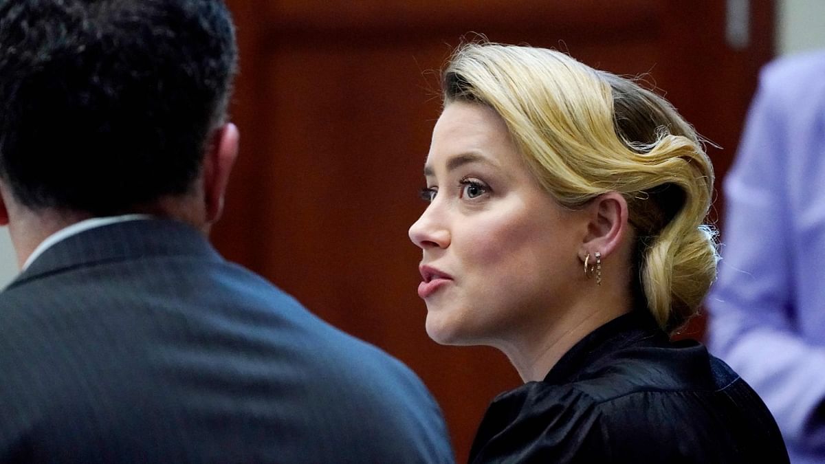 Actress Amber Heard talks to her attorney in the courtroom at the Fairfax County Circuit Courthouse in Fairfax, Virginia, Credit: AFP Photo