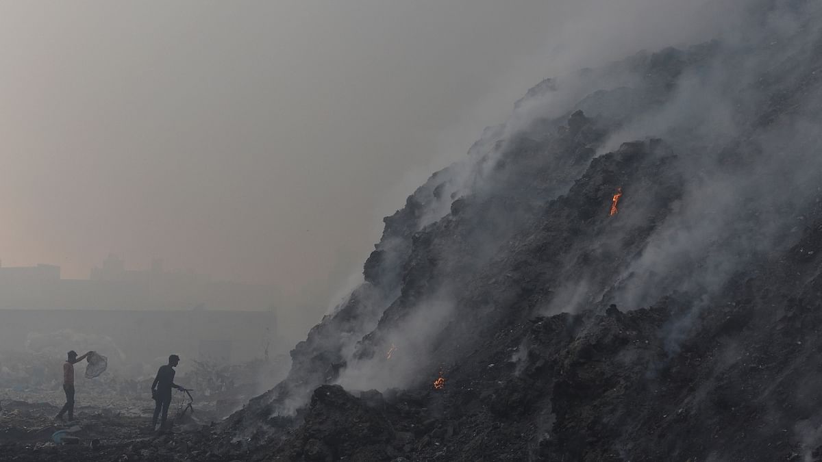 Smoke billows from the burning garbage at the Bhalswa landfill site in New Delhi. Credit: PTI Photo