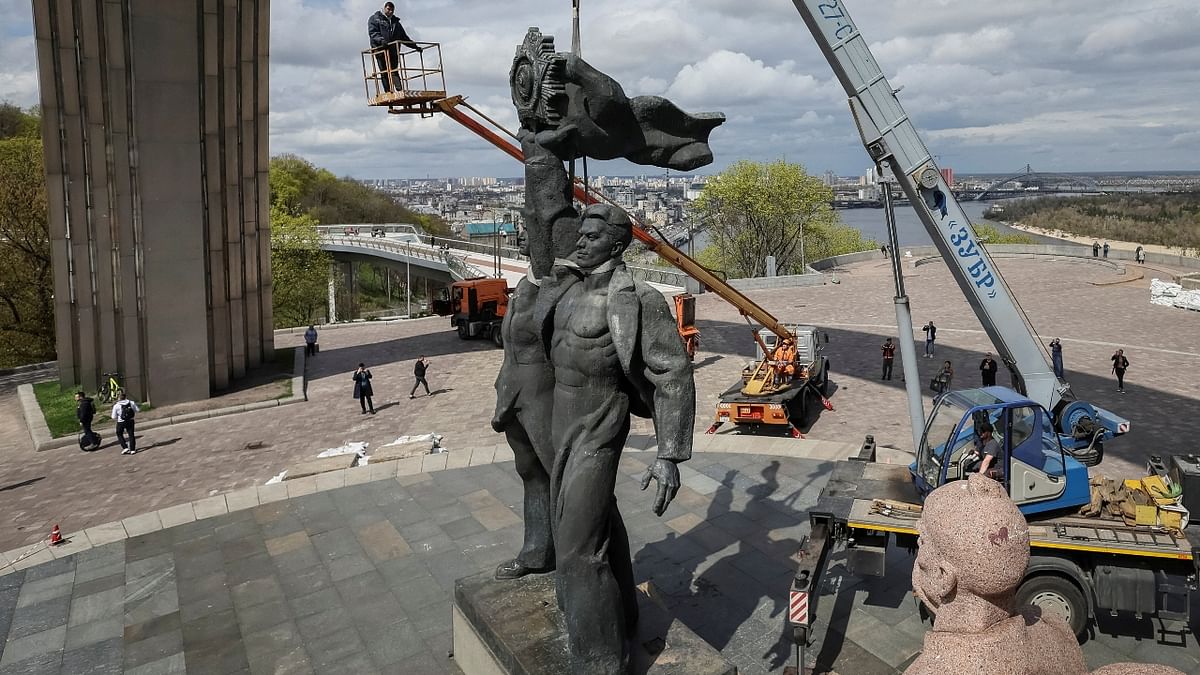 The eight-metre (27-ft) bronze statue depicted a Ukrainian and Russian worker on a plinth, holding aloft together a Soviet order of friendship. Credit: Reuters Photo