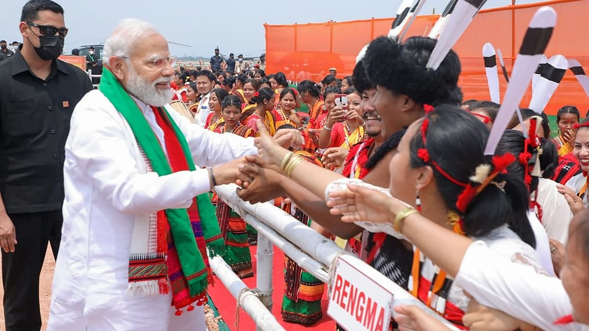 Prime Minister Narendra Modi greets BJP supporters as he arrives to address the ‘unity, peace and development rally’ at Loringthepi in Karbi Anglong district, Assam. Credit: PTI Photo