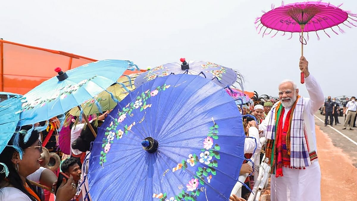 Prime Minister Narendra Modi interacts with the supporters during the ‘unity, peace and development rally’ at Loringthepi in Karbi Anglong, Assam. Credit: PTI Photo