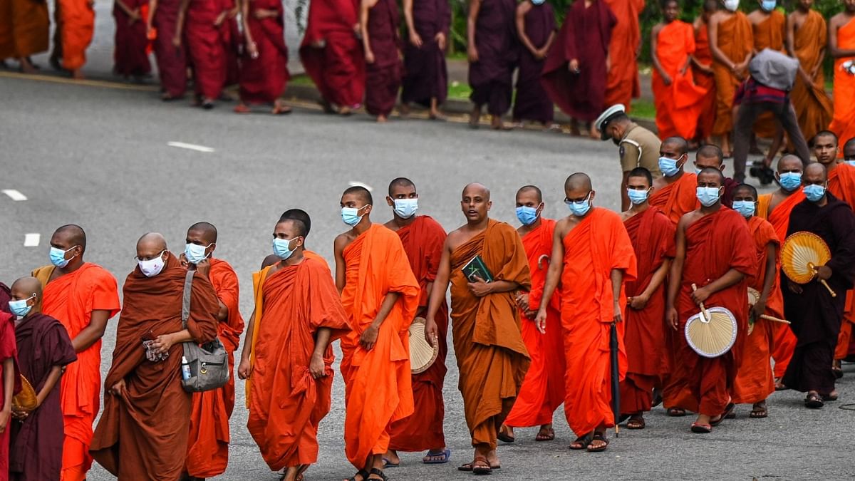 Buddhist monks arrive for a meeting at Colombo's Independence Memorial Hall in Colombo on April 30, 2022, to express their solidarity with countrymen demonstrating against the government over the country's crippling economic crisis. Credit: AFP Photo