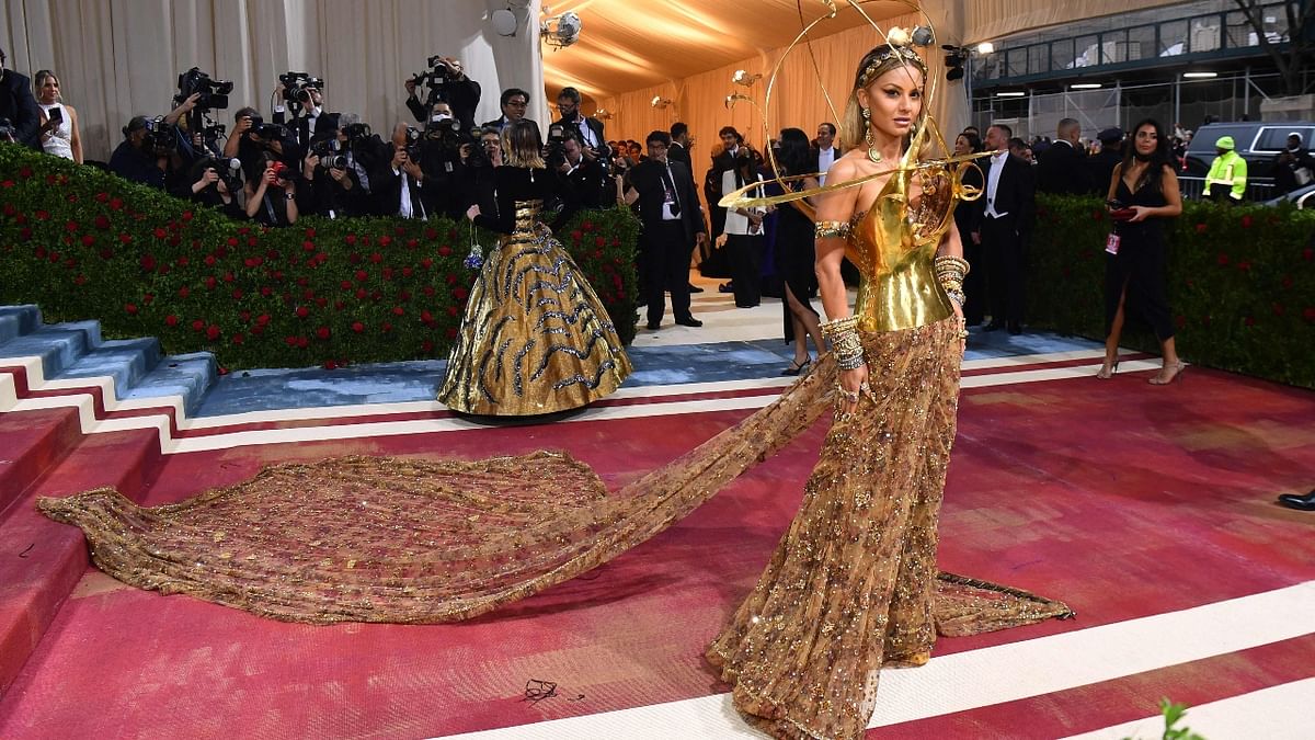 Natasha looked stunning in her Sabyasachi-meets-Schiaparelli creation at the Met Gala 2022. She wore an exquisite Sabyasachi saree paired with a Schiaparelli hand-forged metal bustier. Credit: AFP Photo