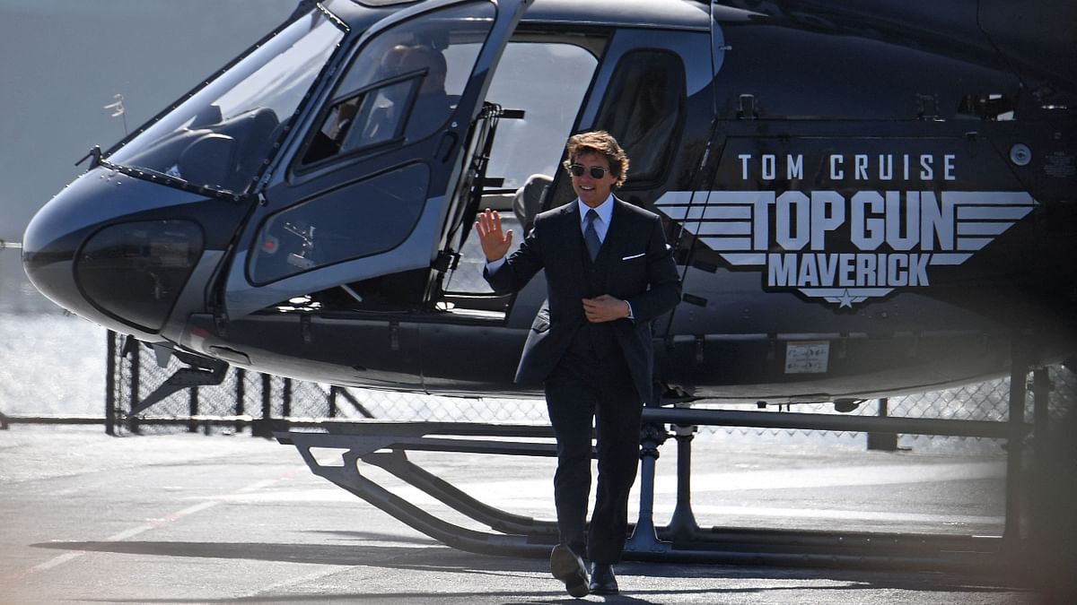 Arguably the world's biggest movie star, Tom Cruise landed via helicopter onto a red carpet that was rolled across the USS Midway's sprawling top deck for the occasion. Credit: AFP Photo