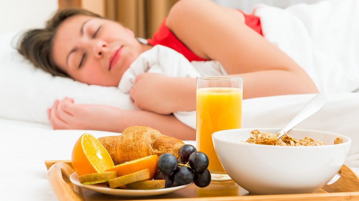 Breakfast in Bed: Start the day by surprising her by waking up early and making something from one of her favourite cookbooks. Credit: Getty Images