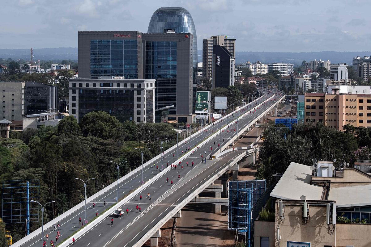 n aerial view of runners taking part in the Nairobi marathon as they run along the new expressway that was flagged off by Kenya's President Uhuru Kenyatta, as an inaugural annual event in Nairobi. Credit: AFP Photo