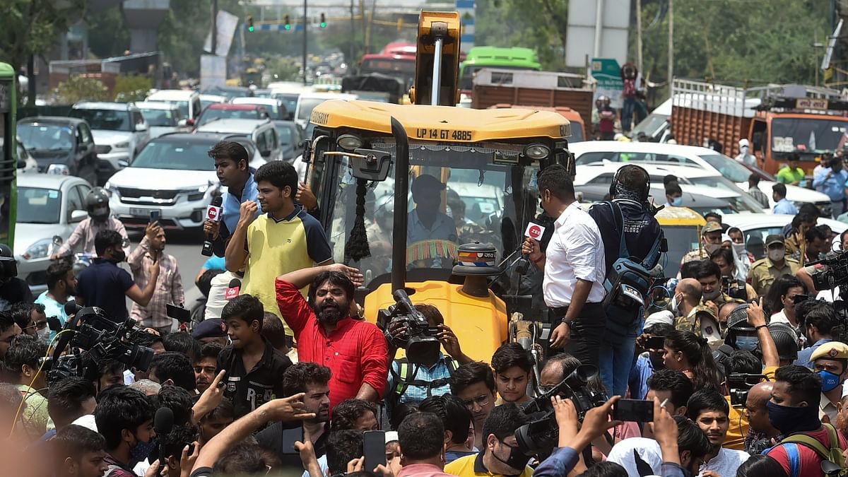 As the bulldozers rolled into Shaheen Bagh for the demolition, locals gathered in large numbers and staged a protest and stopped the officials from carrying out the exercise. Credit: PTI Photo