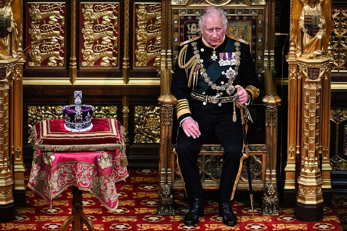 Britain's Prince Charles, Prince of Wales (R) sits by the The Imperial State Crown (L) in the House of Lords Chamber, during the State Opening of Parliament, in the Houses of Parliament, in London. Credit: AFP Photo