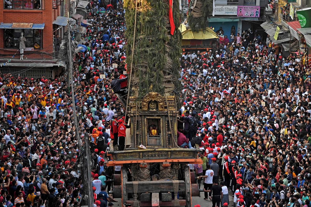 Devotees pull a chariot as they take part in the festivities to mark the Rato Machindranath chariot festival in Lalitpur. Credit: AFP Photo