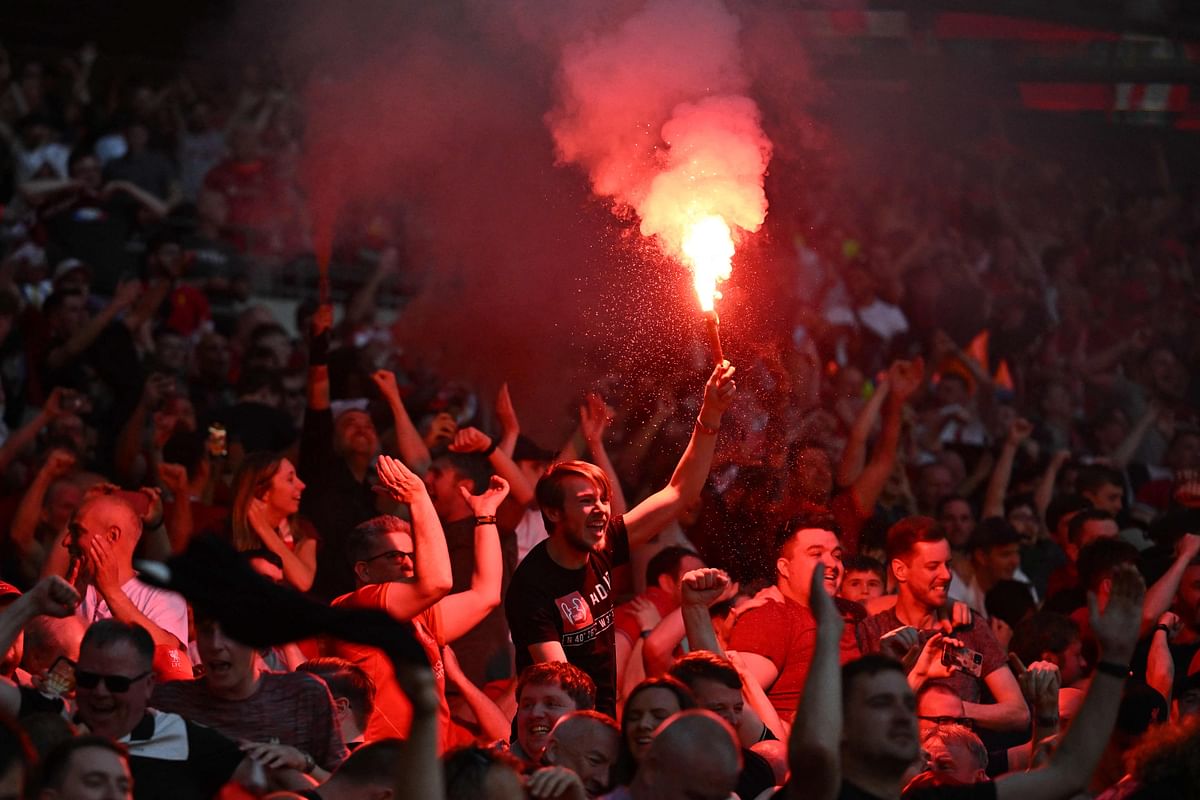 Liverpool's fans celebrate after they win the English FA Cup final football match between Chelsea and Liverpool, at Wembley stadium, in London. Credit: AFP Photo
