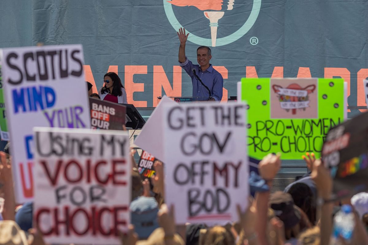 Abortion rights activists and supporters march outside of the Austin Convention Center where the American Freedom Tour with former President Donald Trump is being held on May 14, 2022 in Austin, Texas. Credit: AFP Photo