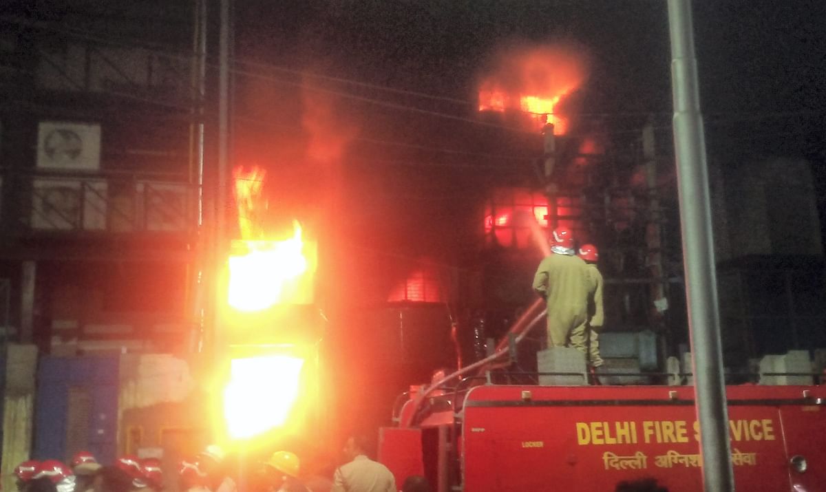 Firefighters try to douse a fire that broke at a plastic granulation factory at Narela, in New Delhi. Credit: PTI Photo
