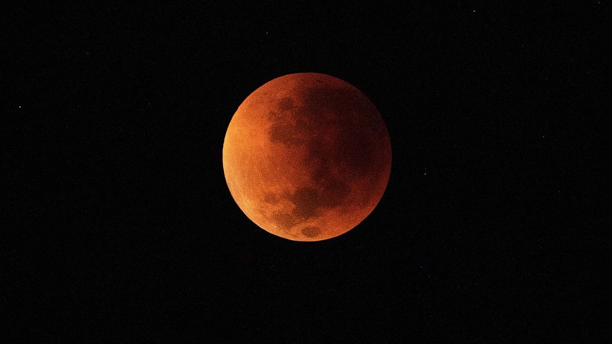 The blood moon is seen during a total lunar eclipse in Rio de Janeiro. Credit: AFP Photo