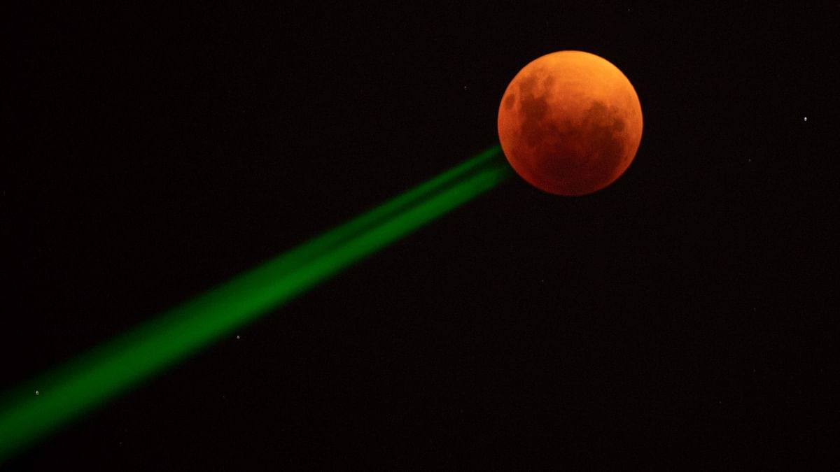 The blood moon is seen during a total lunar eclipse in Santiago, Chile. Credit: AFP Photo