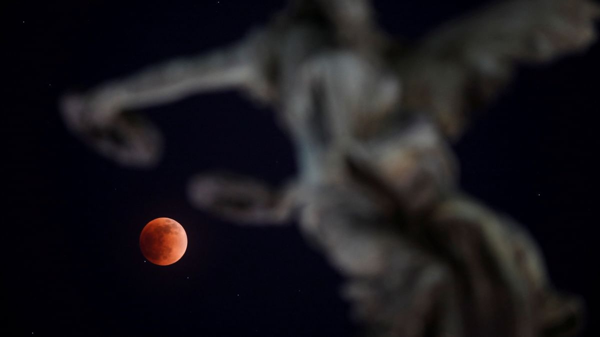 A full moon moves through the shadow of the earth during a