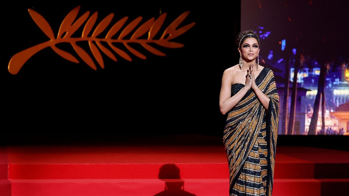 Deepika Padukone dazzled in Sabyasachi Mukherjee's Bengal Tiger sari as she walked the red carpet on the opening night of the Cannes Film Festival on May 17, 2022. Credit: Reuters Photo