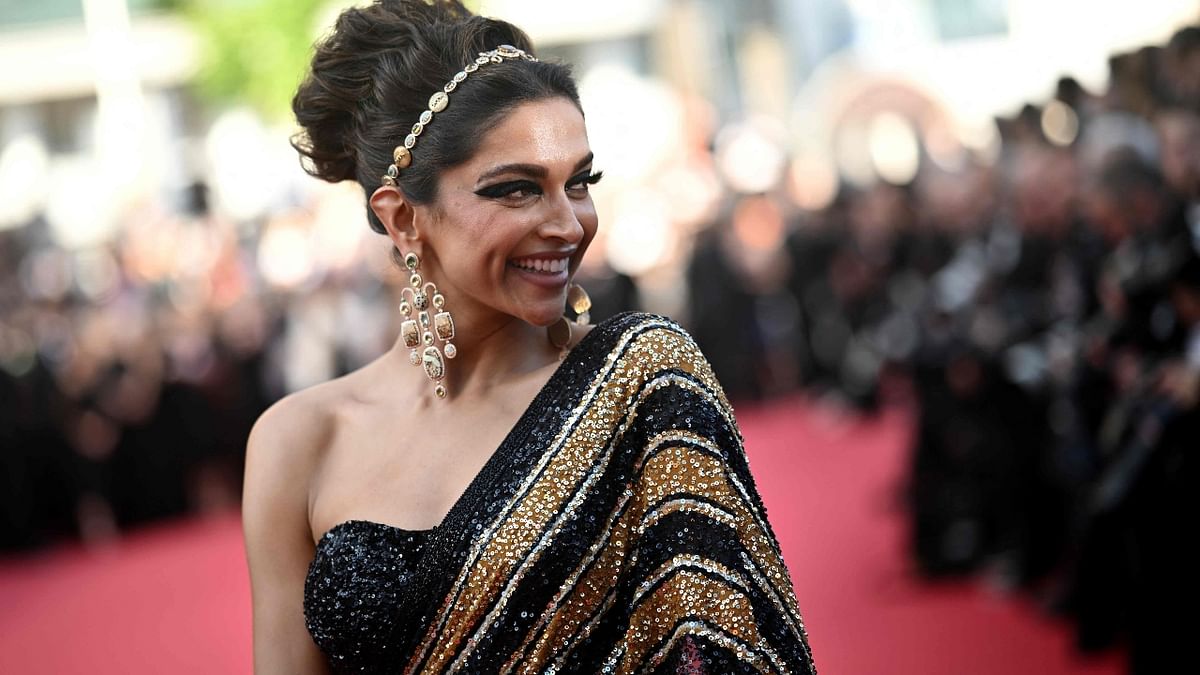 Her look stood out because of its golden and black stripes, inspired by the big cat after which Sabyasachi's collection is named. Credit: AFP Photo