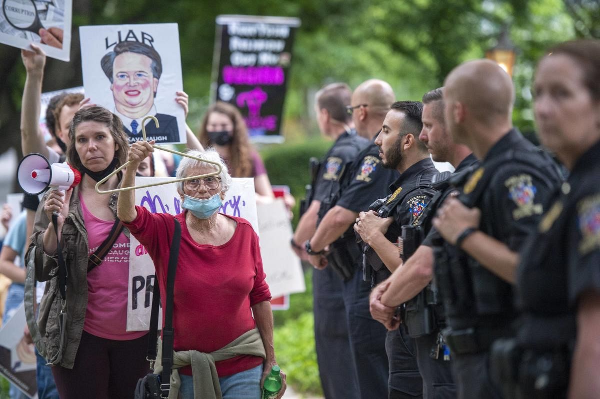 Protests have been organized intermittently outside the homes of justices who signed onto a draft opinion that would overturn the landmark Roe v Wade decision, which made abortion legal across the US. Credit: AFP Photo