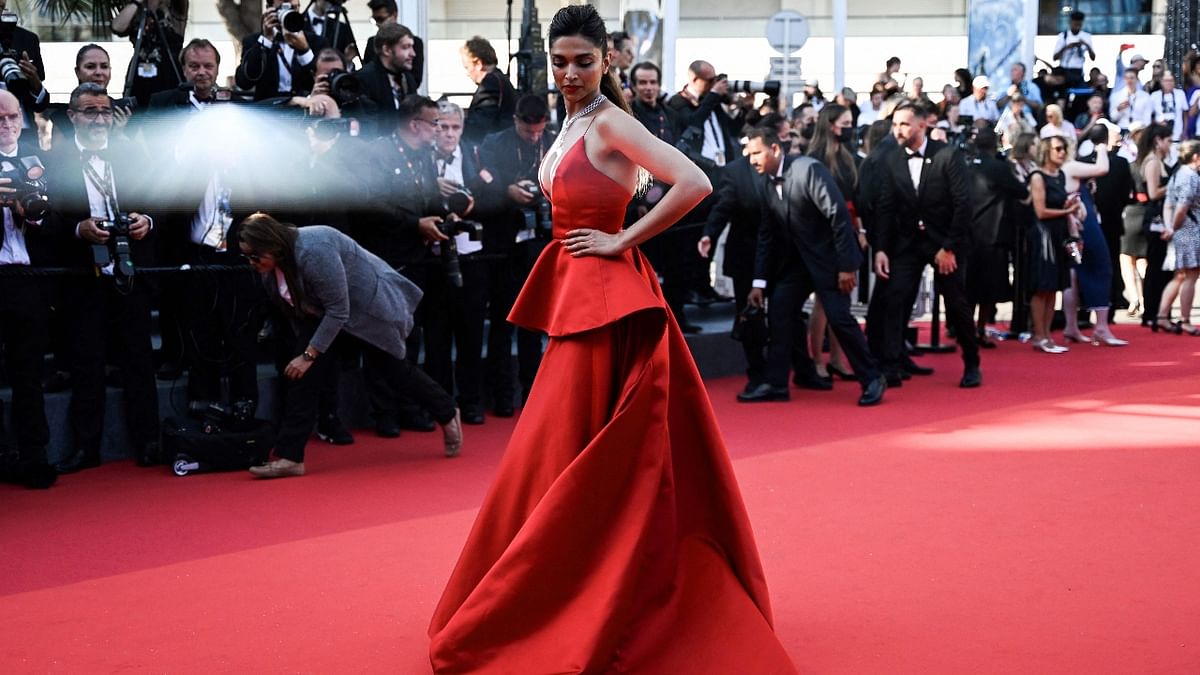Deepika looks uber hot in a stunning red LV gown. Credit: AFP Photo