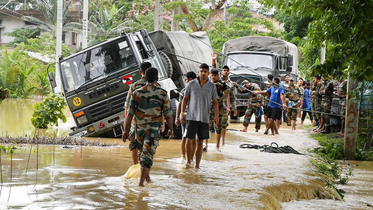 The flood situation in Assam further deteriorated with the death of four more persons, taking the death toll to 18, officials said, adding over 8.39 lakh people have been affected in 32 of the state's 34 districts. Credit: PTI Photo