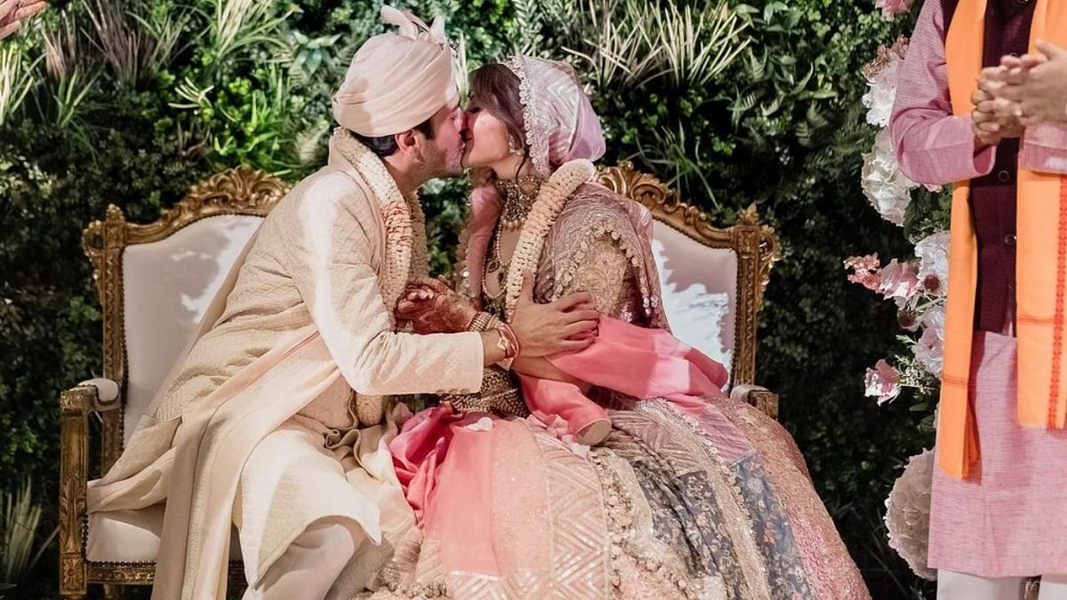 In one of the pictures, the couple was seen sharing a kiss at the wedding. Credit: Instagram/kanik4kapoor