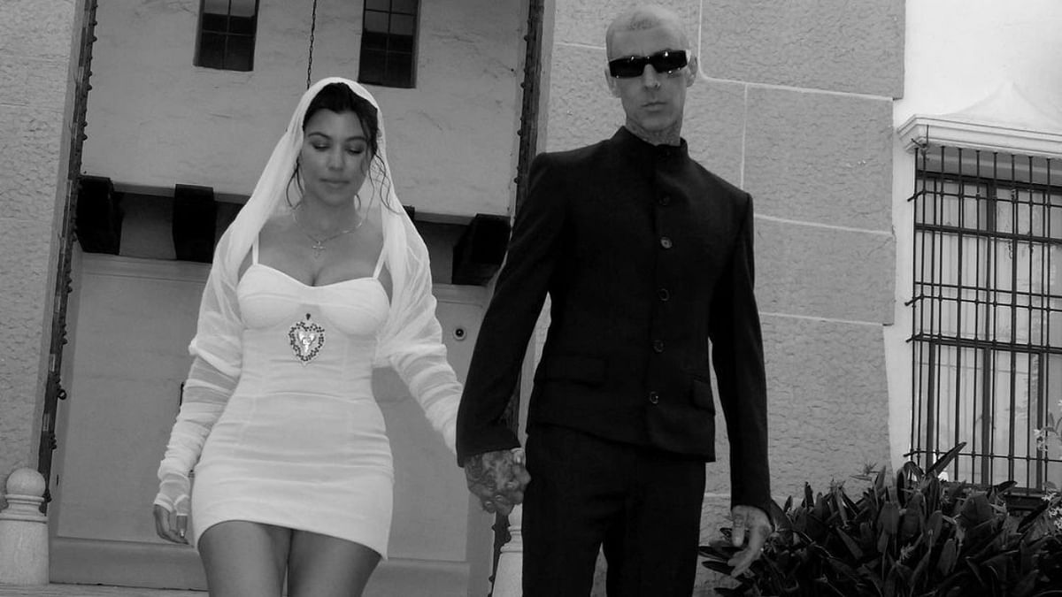 Kourtney was seen donning a stunning Dolce & Gabbana dress with a huge cathedral veil. While Barker looked dapper in his custom black suit. Credit: Instagram/kourtneykardash