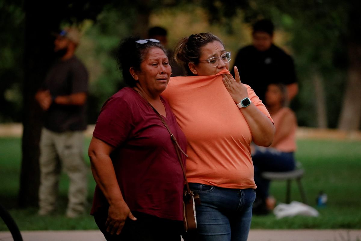 People react outside the Ssgt Willie de Leon Civic Center, where students had been transported from Robb Elementary School after a shooting, in Uvalde. Credit: Reuters File Photo