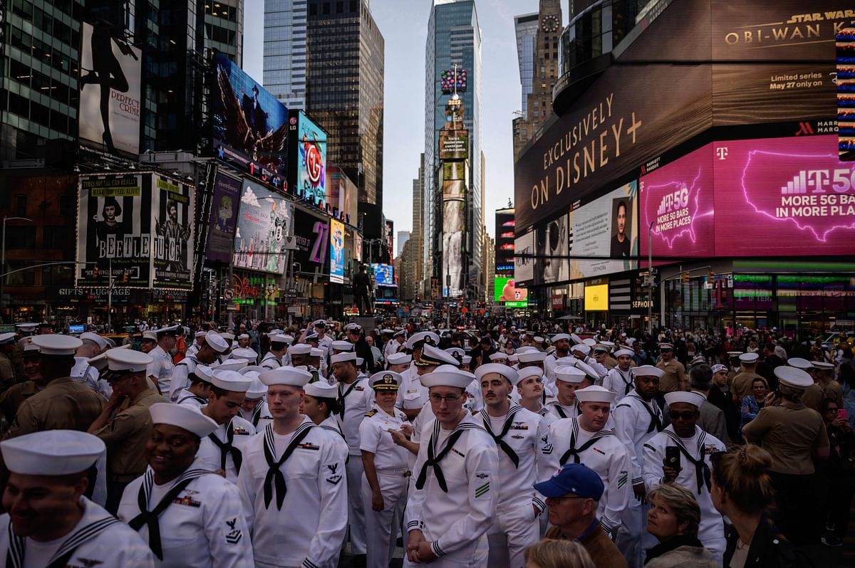 US servicemembers gather for a group photo in Times Square, as part of 'Fleet Week' celebrations in New York. Credit: AFP Photo