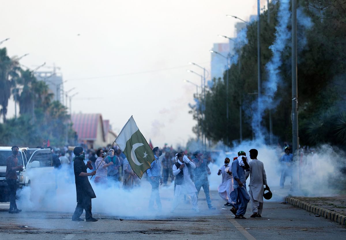Police fire tear gas to disperse supporters of Pakistan's key opposition party, in Islamabad. Credit: AP Photo