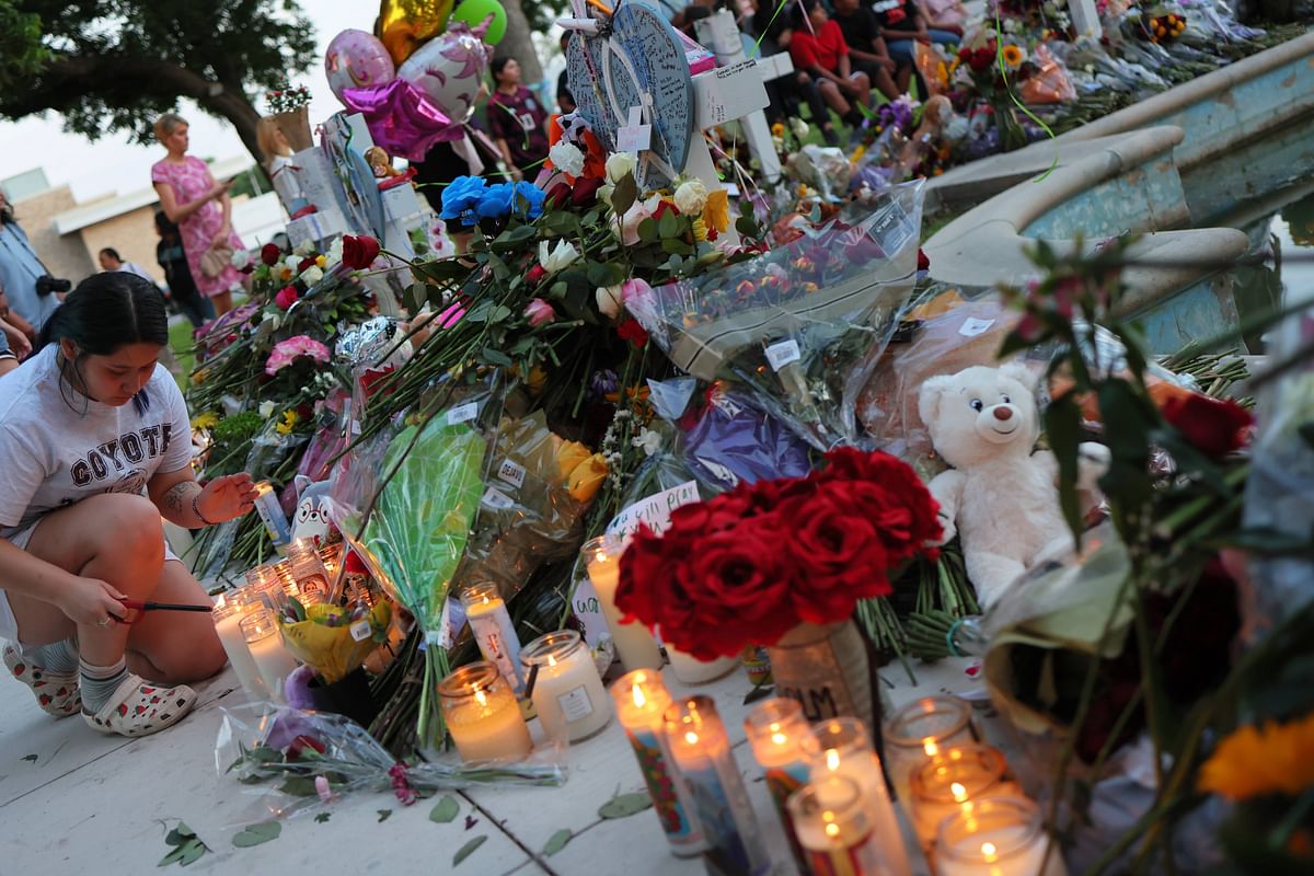 People visit memorials for victims of the May 24th mass shooting. Credit: AFP