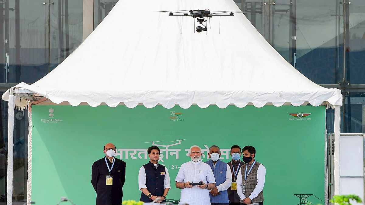 PM Modi tried his hand at flying a drone during the inauguration of the two-day Bharat Drone Mahotsav 2022.Credit: PTI Photo