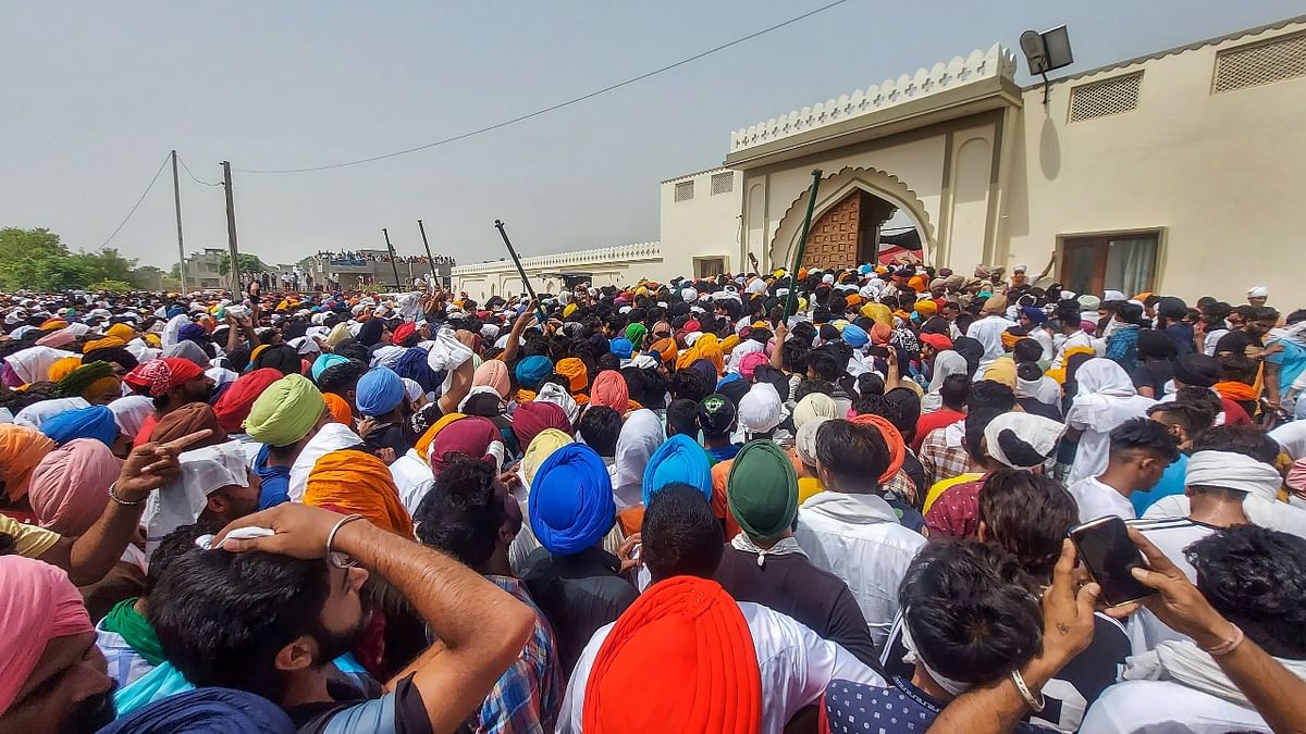 Thousands of mourners thronged Sidhu Moosewala's residence to pay their last respects to the Punjabi singer at his funeral in Mansa, Punjab on May 31, 2022. Credit: PTI Photo