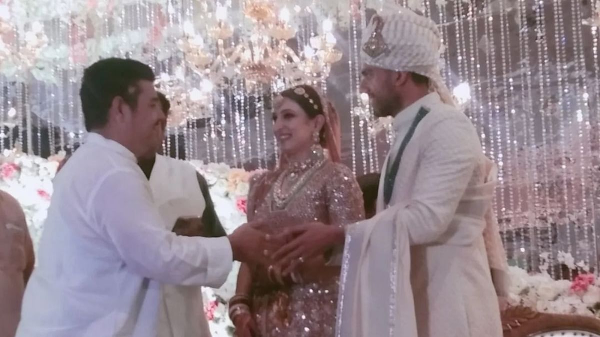 A guest felicitates Deepak and Jaya on their wedding. Credit: Special Arrangement