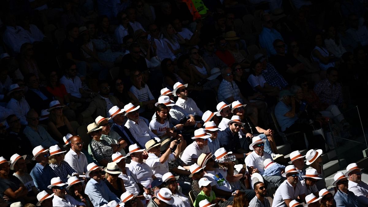 Spectators look on as Poland's Iga Swiatek plays Russia's Darya Kasatkina during their women's semi-final singles match on day twelve of the Roland-Garros Open tennis tournament at the Court Philippe-Chatrier in Paris. Credit: AFP Photo