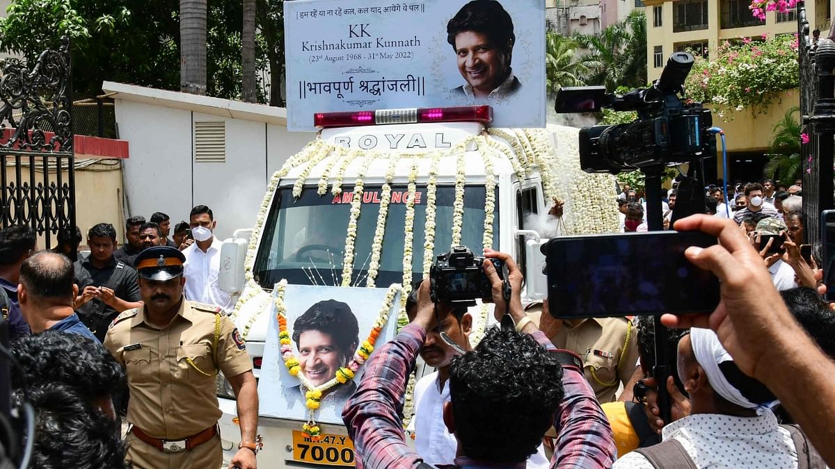 An ambulance adorned with flowers and a picture of KK, carried the singer's body to the crematorium. Credit: PTI Photo