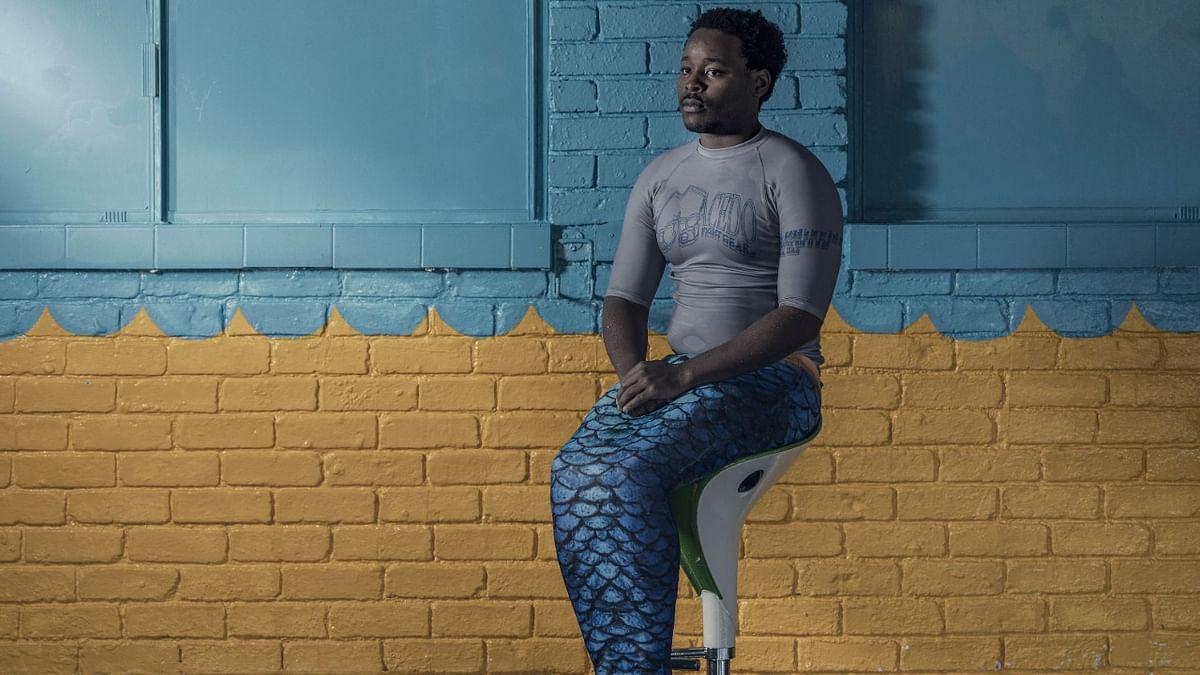 Zizwe Ndwandwe, 29, poses for a portrait in her mermaid attire at the Merschool centre in Kayalami, Midrand. Credit: AFP Photo