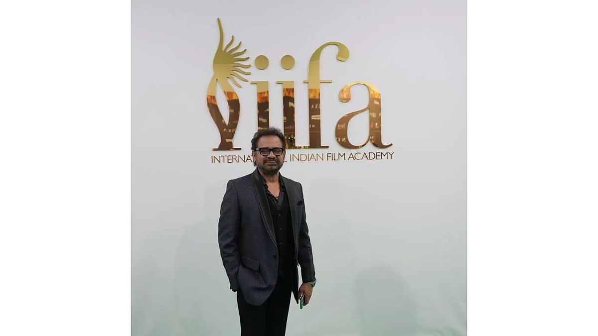 Filmmaker Anees Bazmee poses as he walks the green carpet. Credit: IIFA