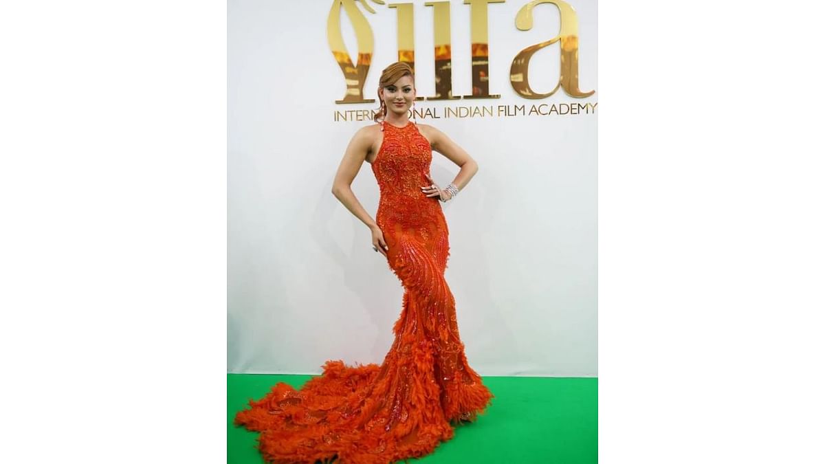 Urvashi Rautela looked bright and beautiful in an orange outfit. Credit: IIFA