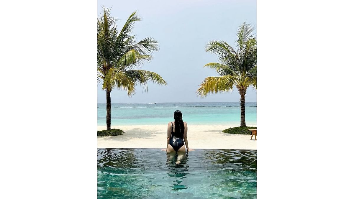 Actress Karisma Kapoor never fails to impress her fans with her vivacious social media posts. Karisma's latest post in a daring black swimsuit from her vacation has scorched social media and the netizens are going gaga over it. Credit: Instagram/therealkarismakapoor