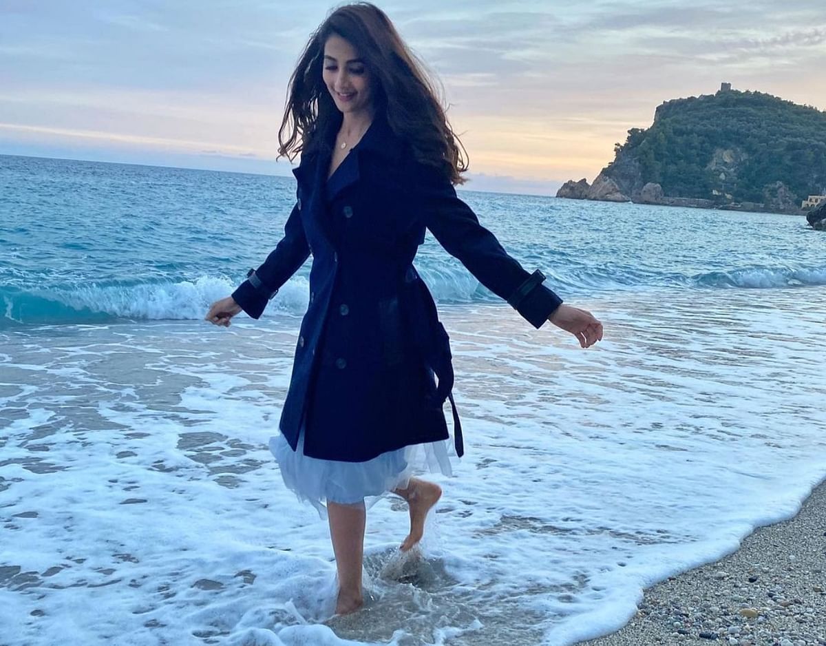 Pooja Hegde enjoys a brisk walk at Plage de Malpasso in Italy. Credit: Instagram/hegdepooja