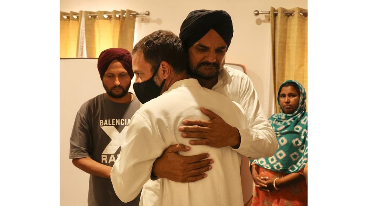Rahul Gandhi is seen sharing a warm hug with the father of late singer and Congress leader Sidhu Moosewala, in Punjab. Credit: INC India