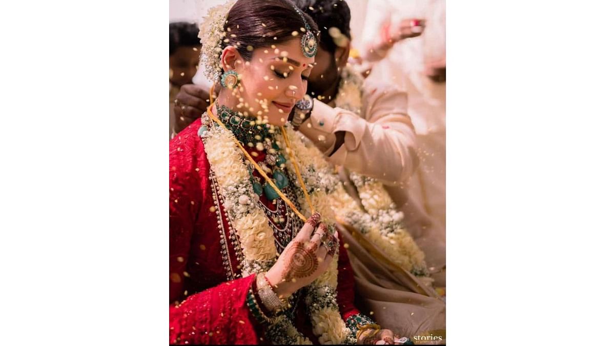 The wedding was performed as per Hindu rituals. In this photo, Vignesh is seen tying mangalsutra. Credit: Instagram/wikkiofficial